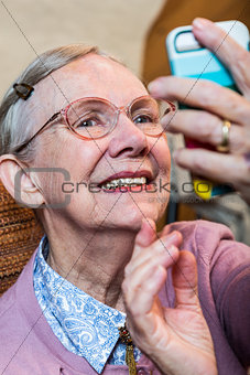 Happy Old Woman Taking Selfie
