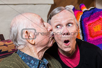 Elderly Gentleman Kissing Elderly Woman on Cheek