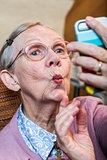 Happy Elder Woman taking Selfie