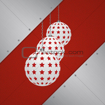 Chirstmas baubles over metal and leather background