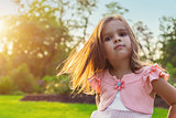Beautiful little girl posing outdoors