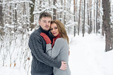 Portrait of happy couple in winter park