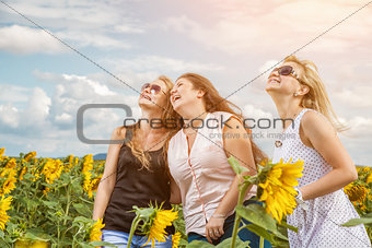 Three friends having a good time outdoors