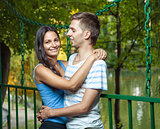 Happy couple embracing in the park
