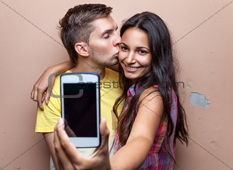 Young happy couple taking a selfie