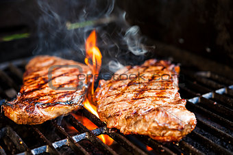 Steaks on barbecue