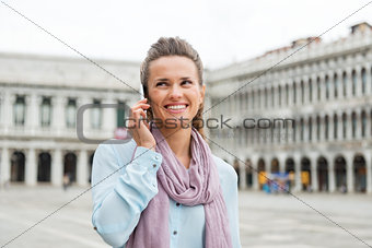 Woman talking on mobile in St. Mark's Square
