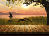 Wooden table with defocussed image of boat on a lake