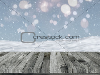 Wooden table with defocussed snowy landscape