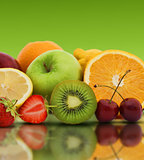 Fresh fruit on a green background
