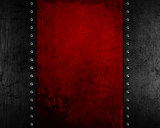 Grunge metal background with red distressed texture
