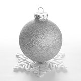 White Christmas Ball and Decorative Snowflake on the White Background