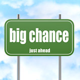 Green road sign with big chance word
