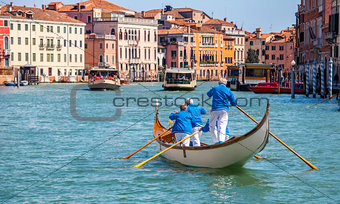 Gondolier gondola on Grand canal Venice italy