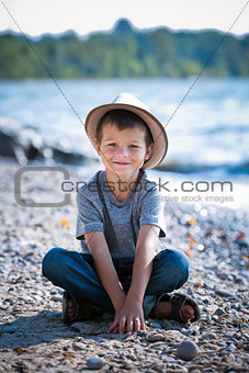 portrait of a little boy wearing hat