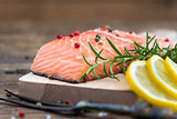 Raw Salmon Fish Fillet with Lemon and Fresh Herbs