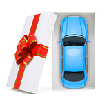 Car in gift box on white, top view