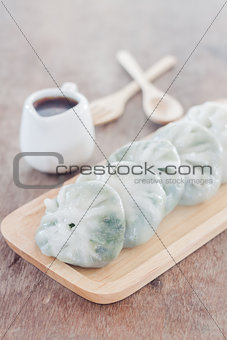 Chinese leek steamed dessert on wooden table
