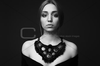 Portrait of young beautiful woman with handmade jewelry