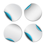 Set of white round stickers with blue backside.