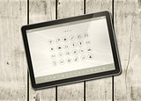 Digital tablet PC on a white wood table