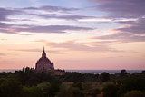 Colorful dramatic sunset of ancient temple in Bagan