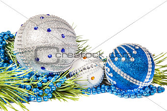 Christmas tree branch and blue with white glitter balls