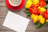 Colorful tulips, greeting card and coffee cup