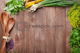 Fresh garden herbs on wooden table