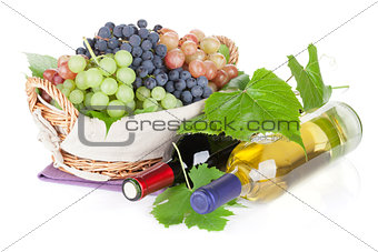 White and red wine bottles and grapes