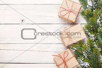 Christmas fir tree with snow and gift boxes