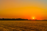 Sunrise over a countryside field