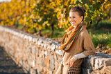 Portrait of relaxed elegant woman in autumn outdoors