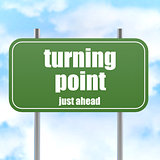 Turning point on green road sign