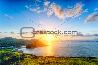 Village with beautiful sunset over hong kong coastline