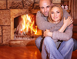 Gentle couple near fireplace