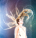 Woman with Wet Dreadlocks Flipping Hair Wildly