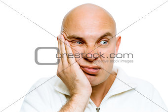 man holding his hand to his cheek. Toothache or problem