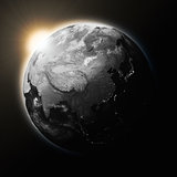 Sun over Southeast Asia on dark planet Earth