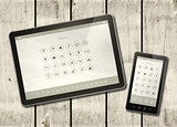 Smartphone and digital tablet PC with desktop icons on a white w