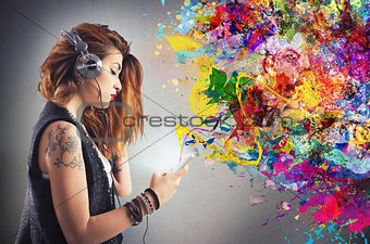 Tattoo girl listens to music