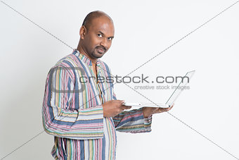 Indian male using computer 