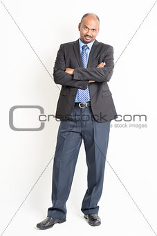 Full body confident mature Indian businessman