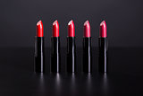 Set of bright lipsticks in shades of red color  