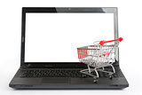 Shopping cart on laptop, front view