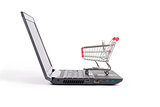 Shopping cart on laptop, side view