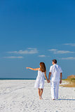 Man Woman Couple Walking Pointing on Empty Beach