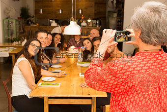 Granny taking a picture of all family