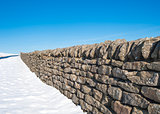 Snow covered wall in winter
