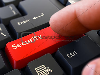 Finger Presses Red Keyboard Button Security.